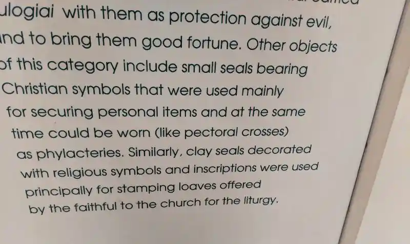 Christian symbols that were used for securing personal items and at the same time could be worn like pectoral crosses as phylacteries.